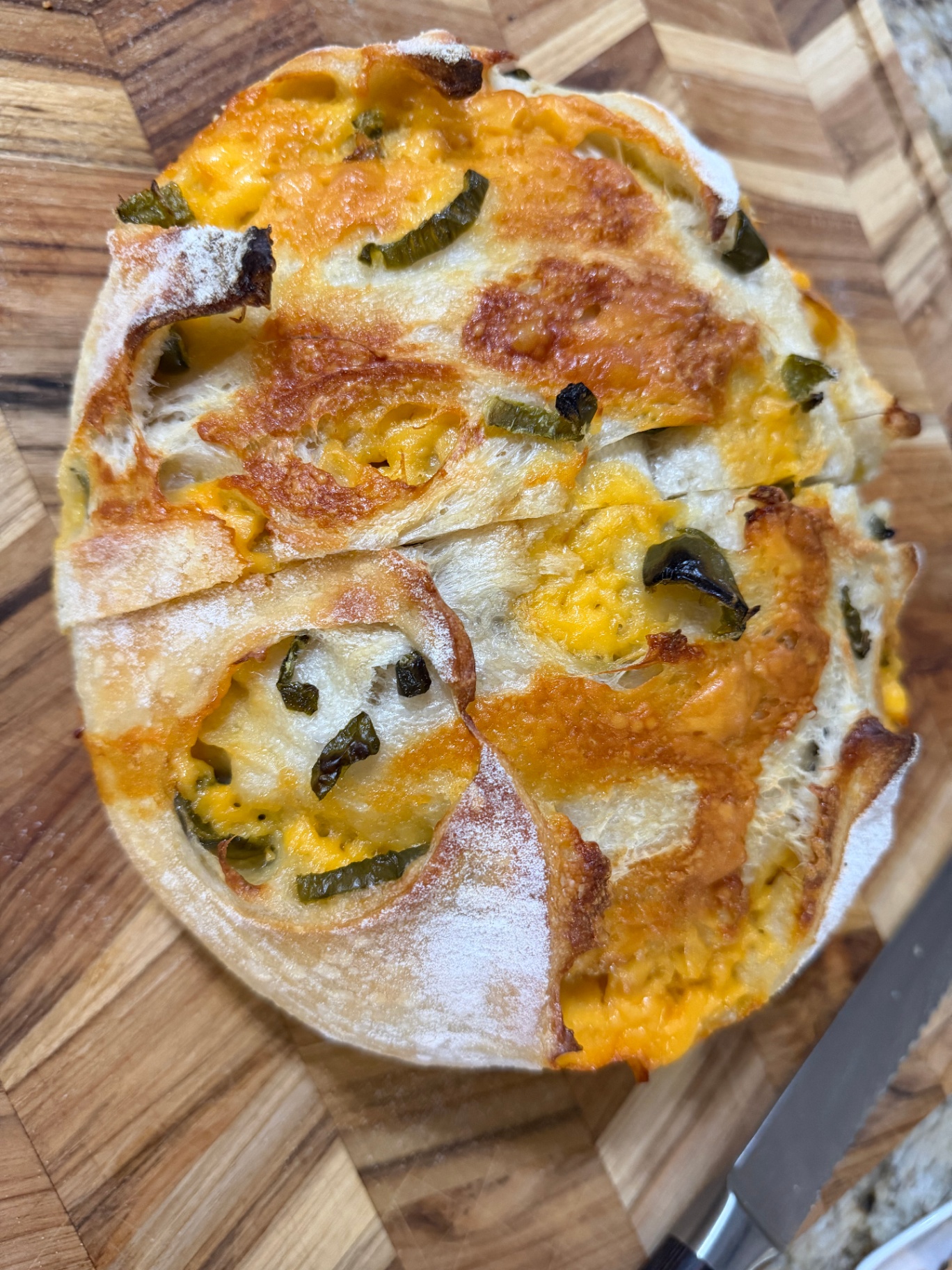 Jalapeño cheddar sourdough with a melted cheese crust