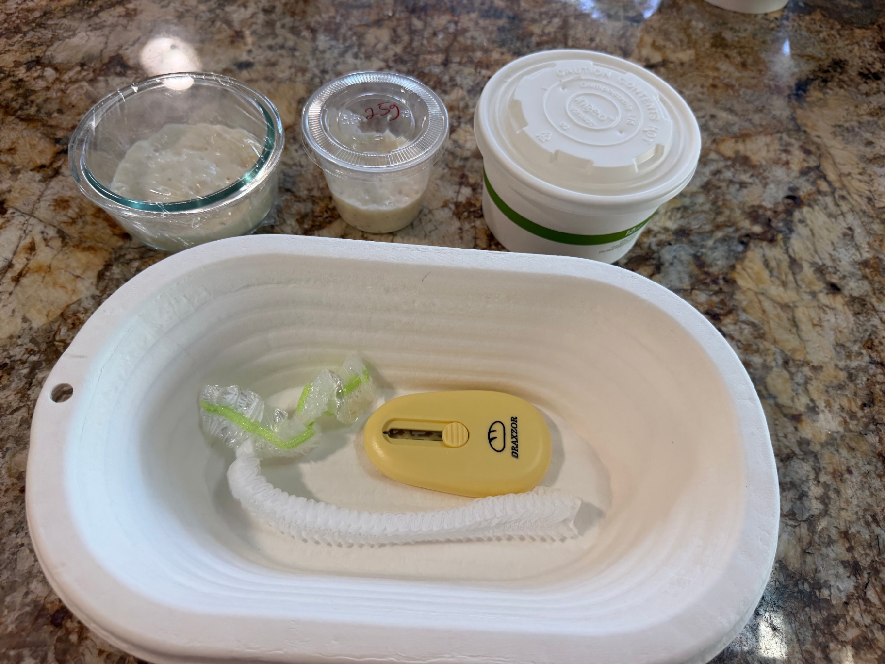 Starter, banneton, and lame ready for shaping