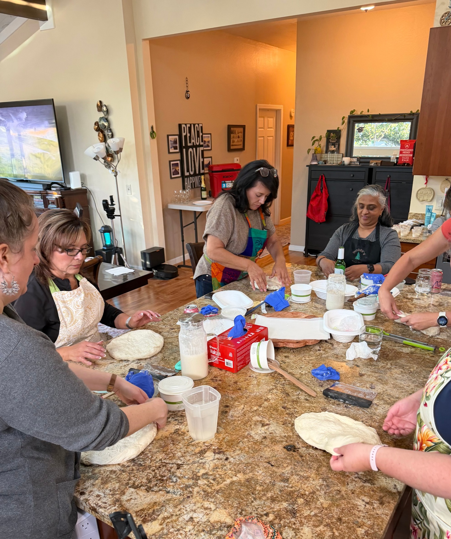 A workshop in full flow — hands, dough, and conversation